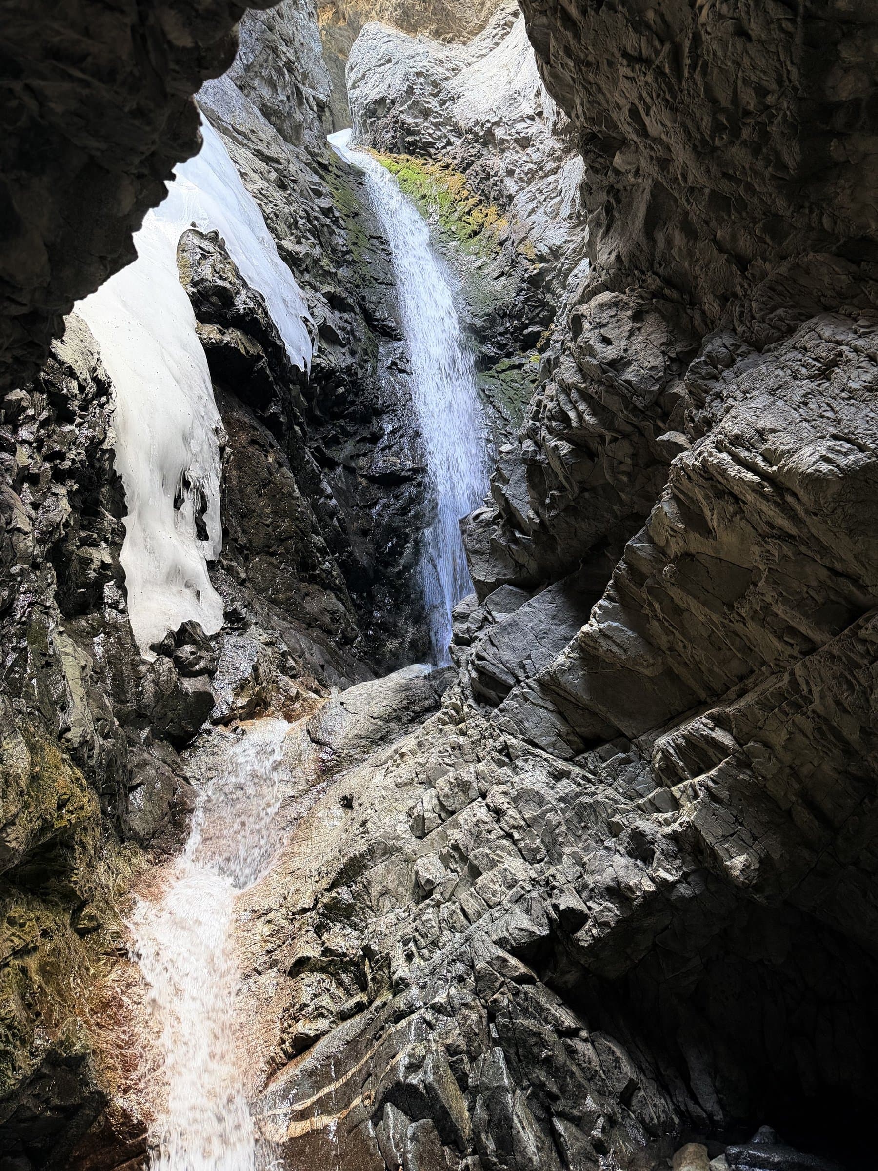 Zapata Falls waterfall with ice in the canyon